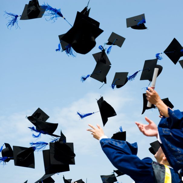 Graduates throwing caps